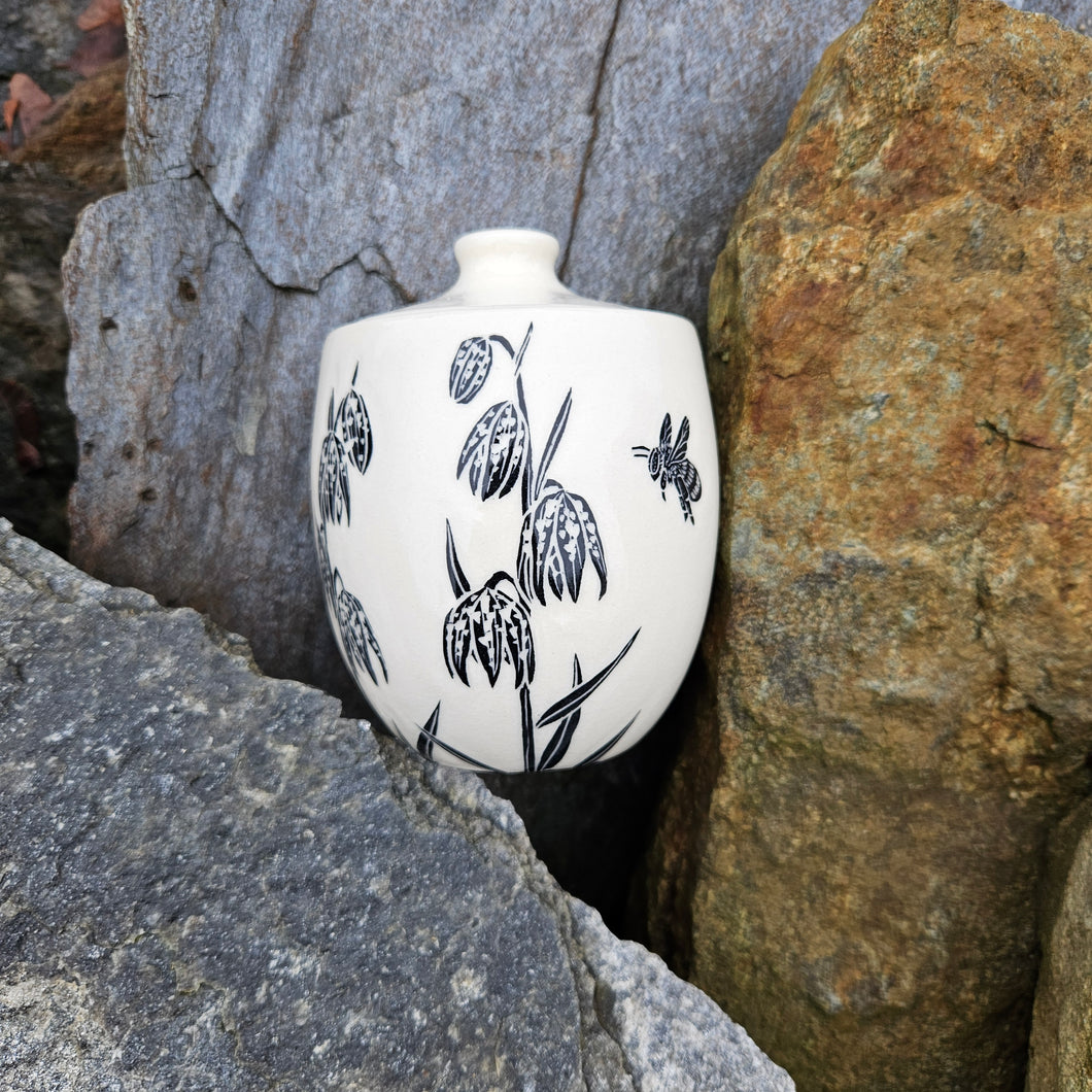 Chocolate lily and bee jar